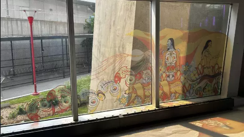 Elements of the mural titled Kiinwin Dabaadjmowin, or “Our Story” as window clings at the CN Tower