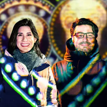 Pedro Narváez and Emma López standing side by side with colourful animation playing over their clothes and on the background.