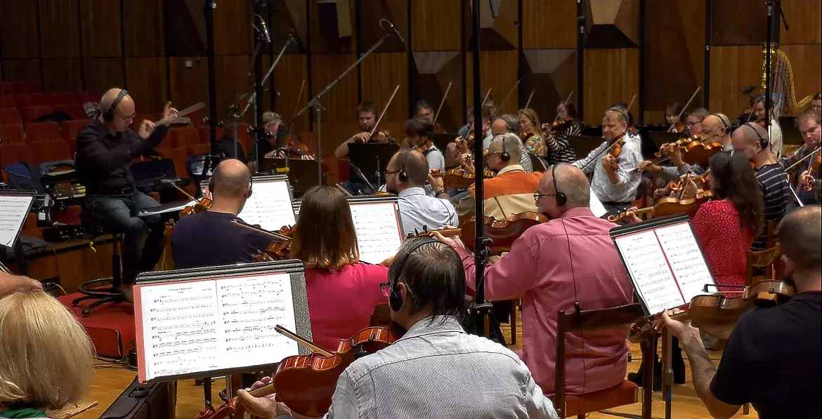 Alejandro Basulto leading his orchestra during a recording