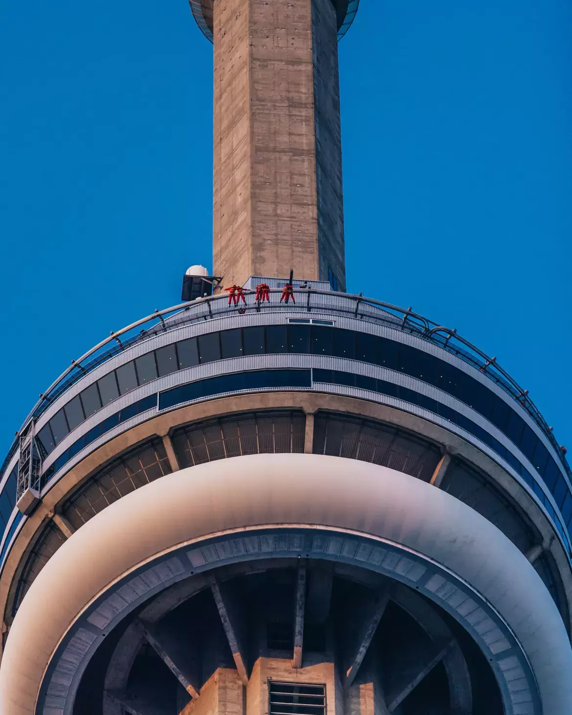 The CN Tower’s Main Pod with a group of people doing the Edgewalk.