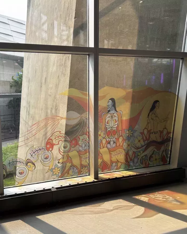 Elements of the mural titled Kiinwin Dabaadjmowin, or “Our Story” as window clings at the CN Tower